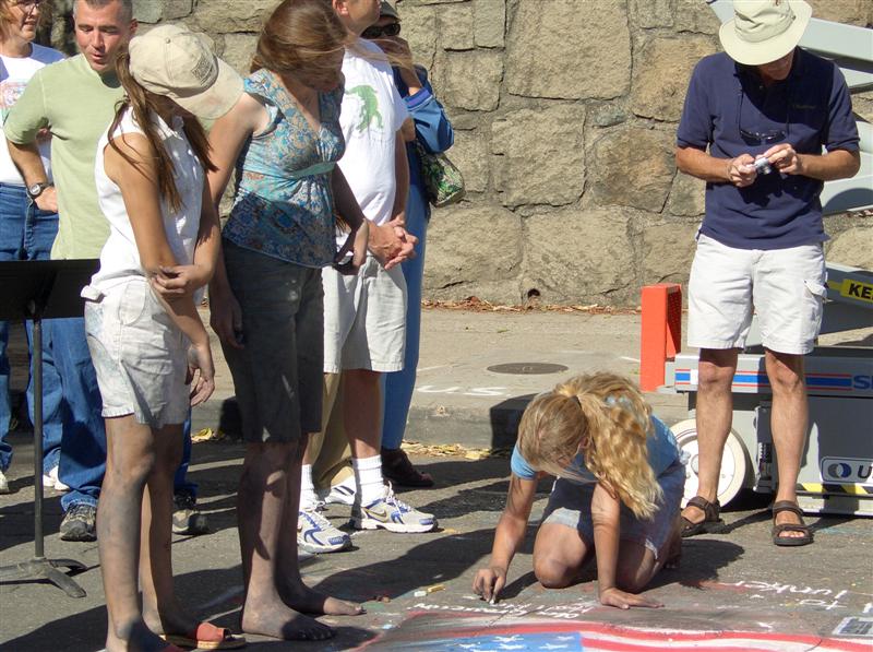 Street painting artists covered in chalk