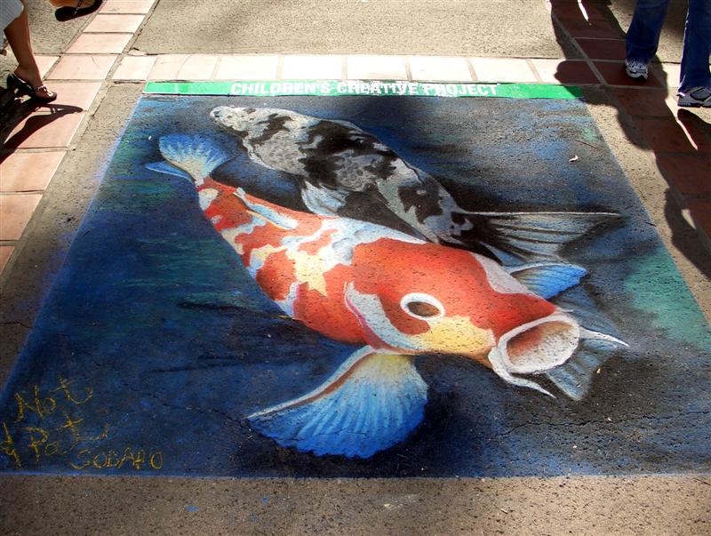 Completed chalk street painting of koi